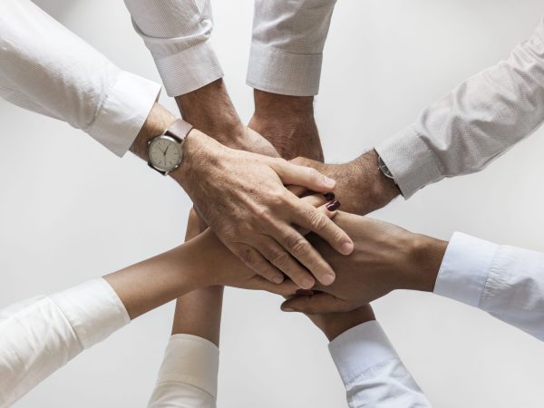 business-hands-joined-together-teamwork (1) (1)